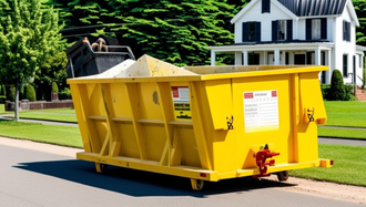 A yellow dumpster is sitting on the side of the road in front of a house.