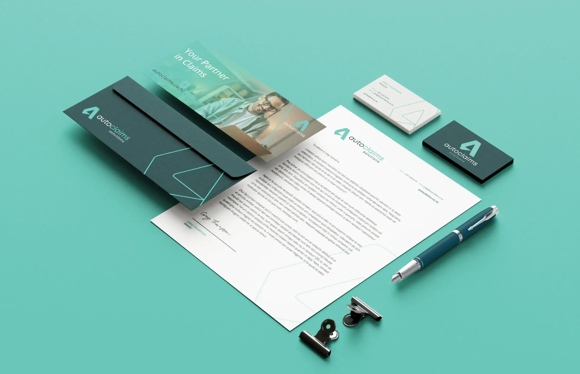 Stationery mockup with teal theme: envelope, letterhead, business card, pen, clips.