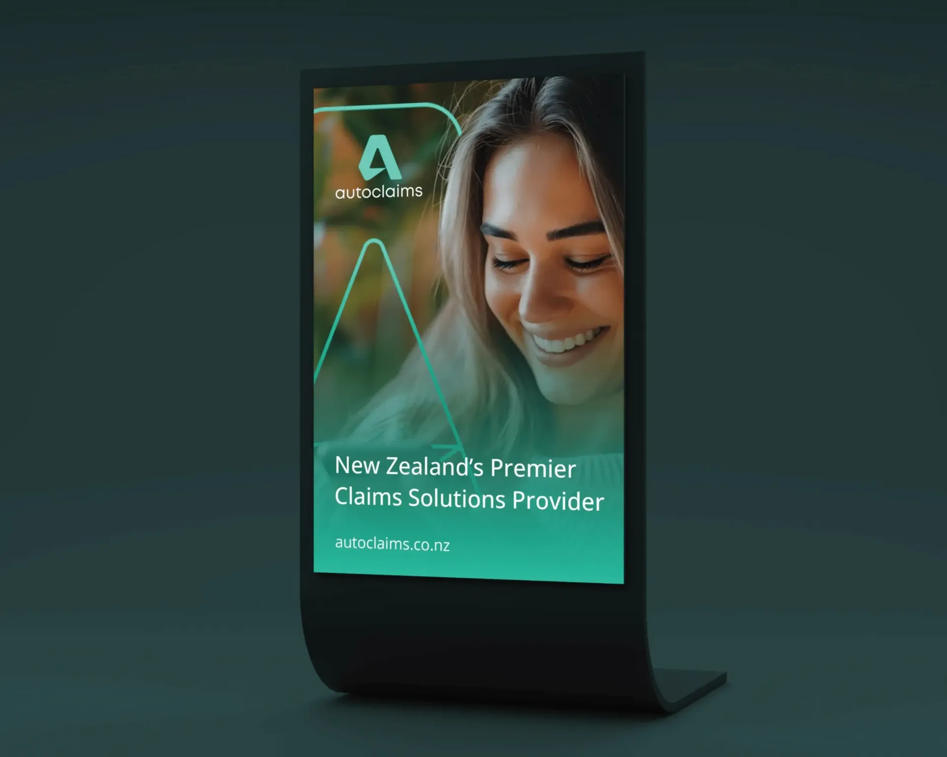 Digital display showing a smiling woman, promoting 