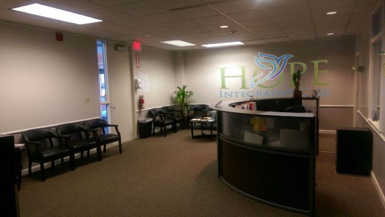 a waiting room with a sign on the wall that says hope