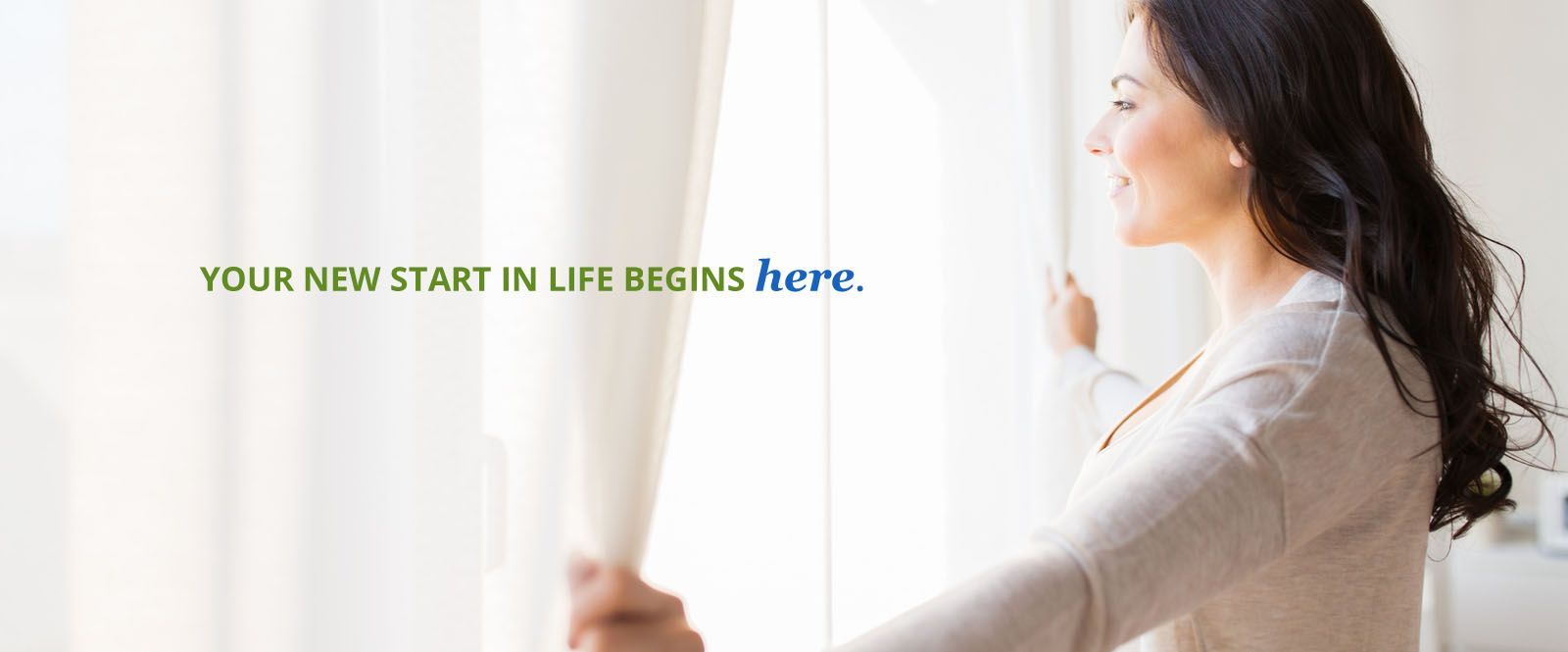 a woman is opening a window with a quote that says `` your new start in life begins here '' .