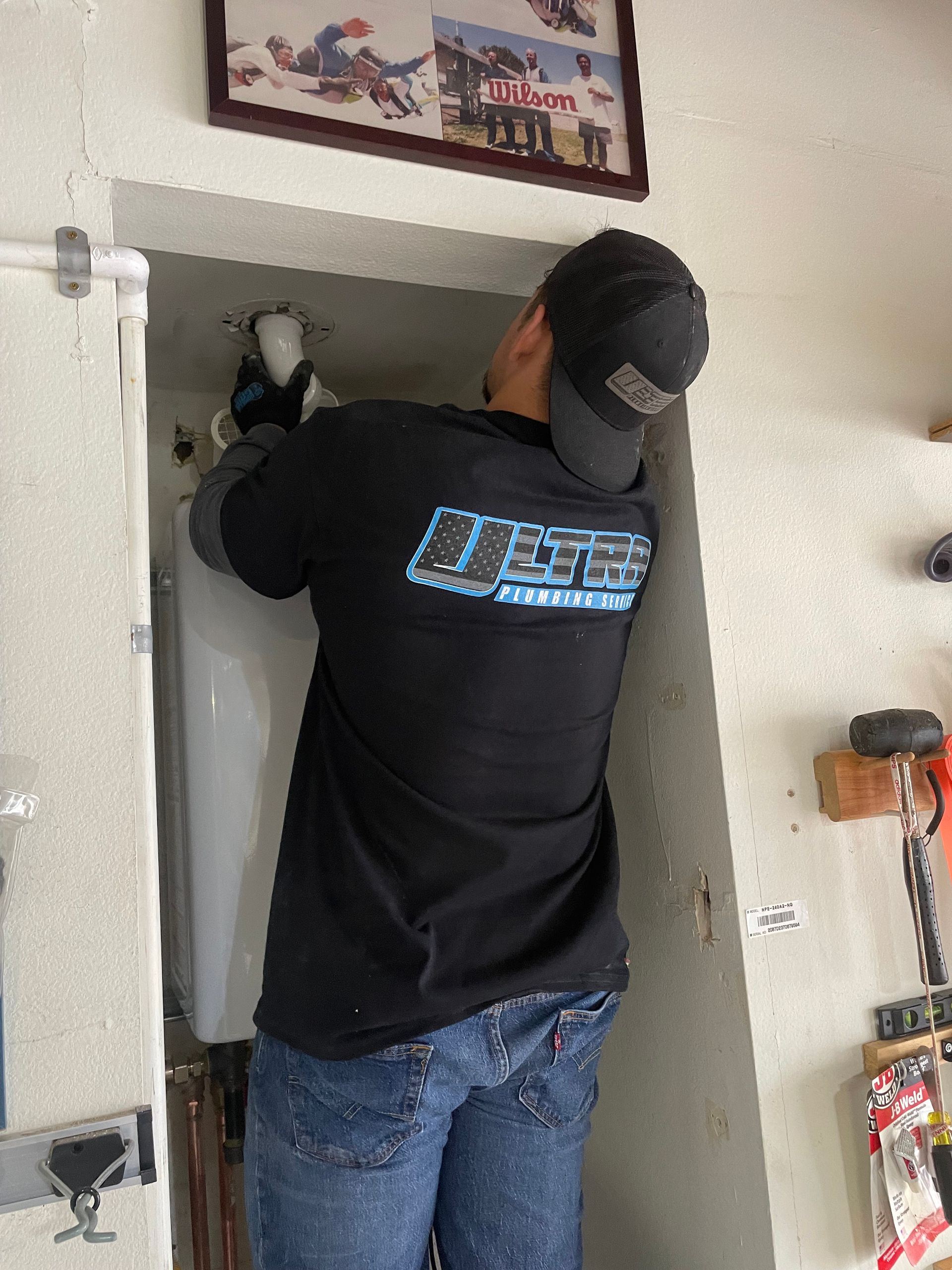 A man wearing a black shirt with the word ice on it