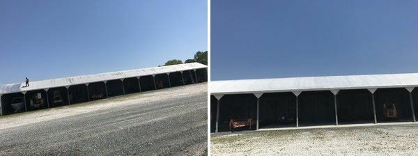 a row of tents are lined up on the side of a road .