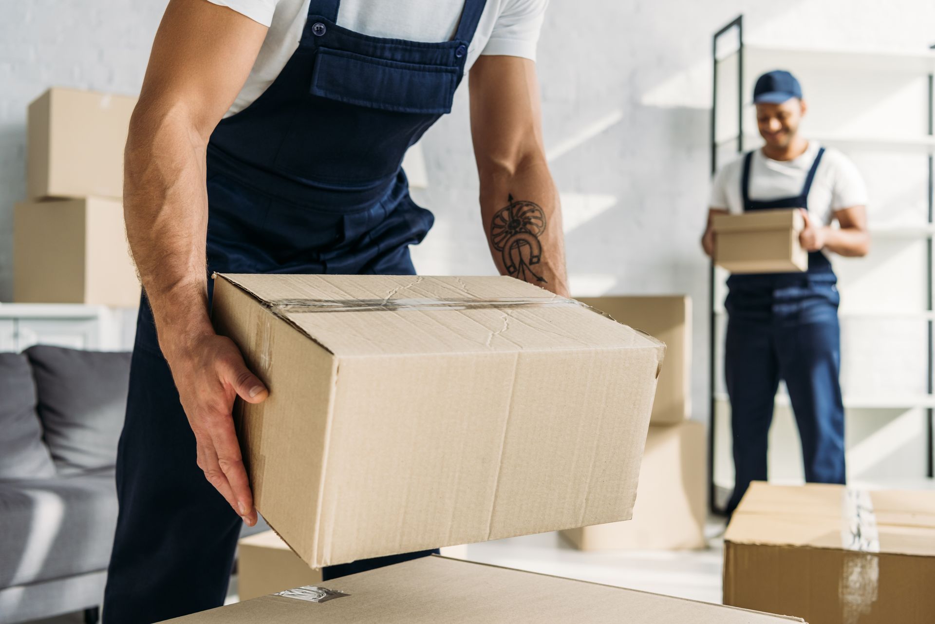A man is carrying a box.