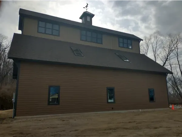 A large building with a weather vane on top of it