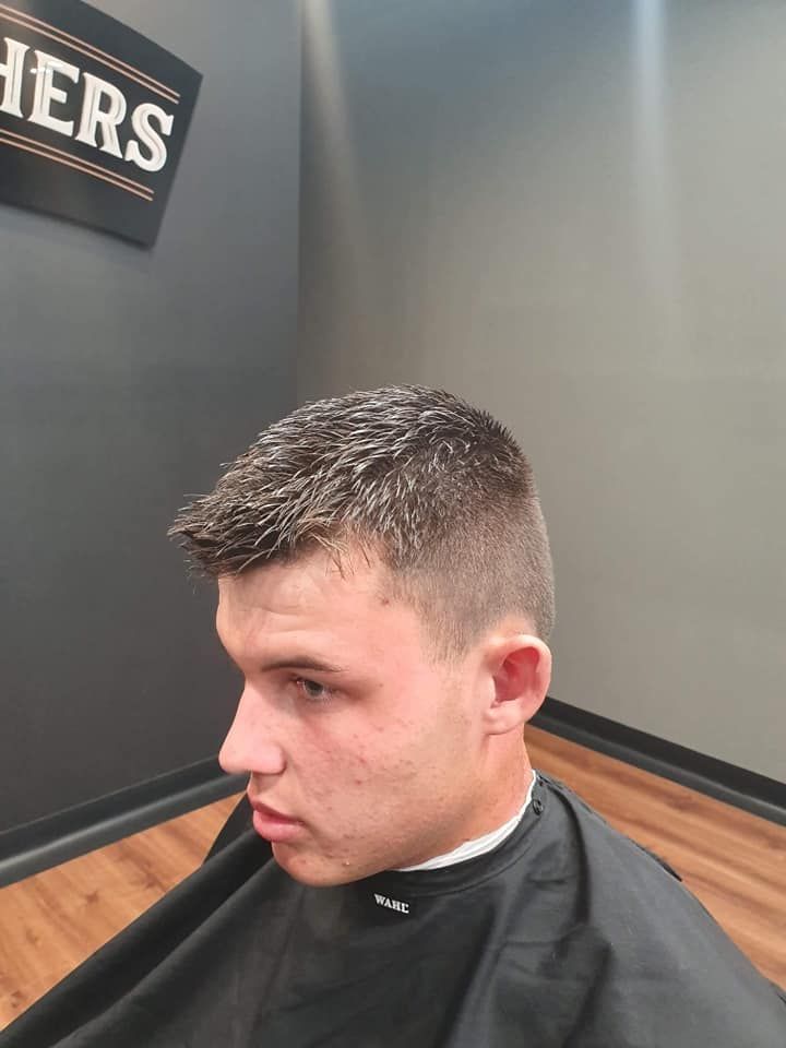 Man With Short Haircut Wearing Black Cape β Bolton Brothers Barbers in Erina, NSW