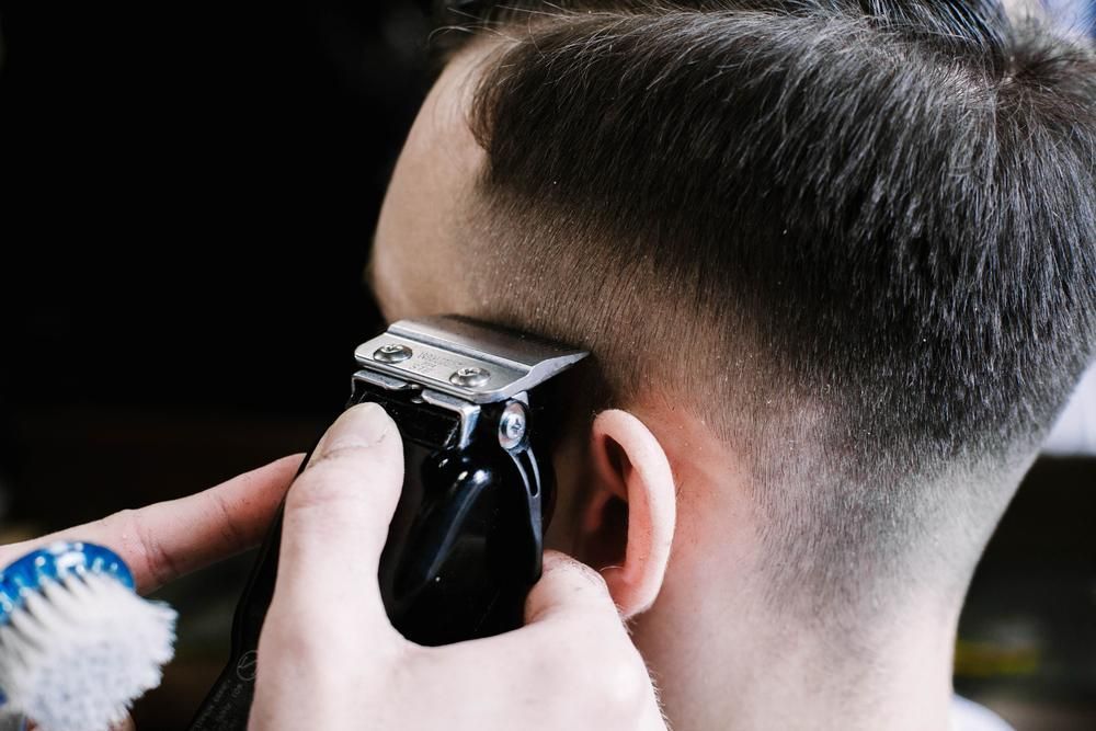 Barber Using Clippers Cutting Hair Close-Up — Bolton Brothers Barbers in Erina, NSW