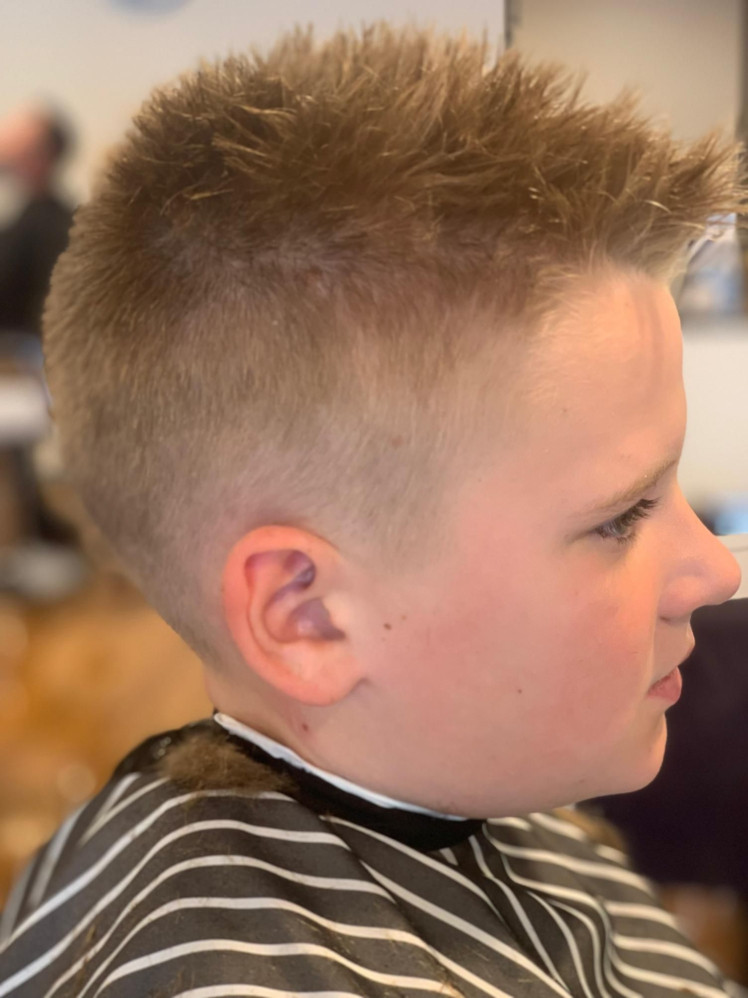Boy With Spiky Blonde Hair In Side Profile — Bolton Brothers Barbers in Erina, NSW