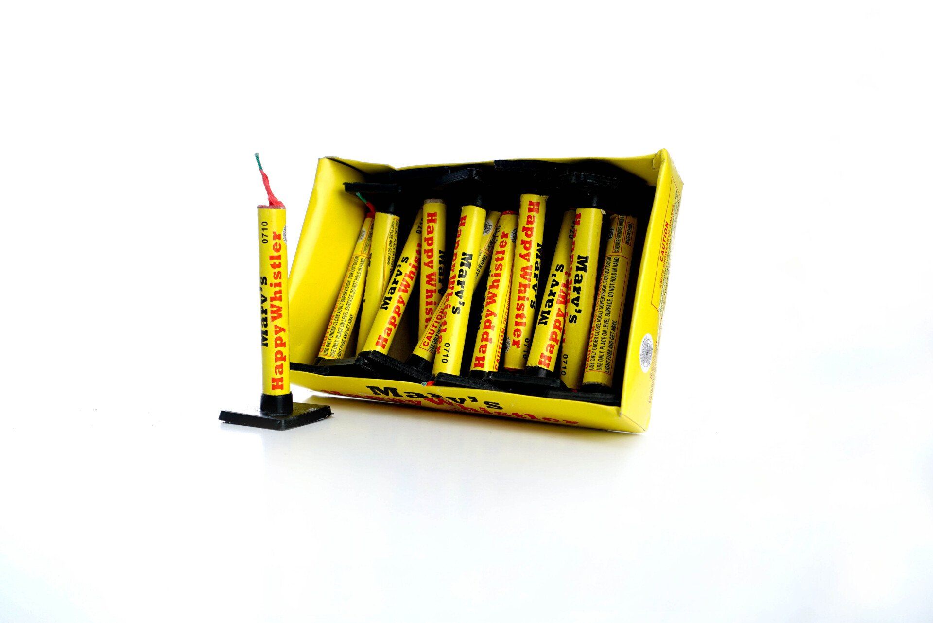 A box of fireworks is sitting on a white surface.