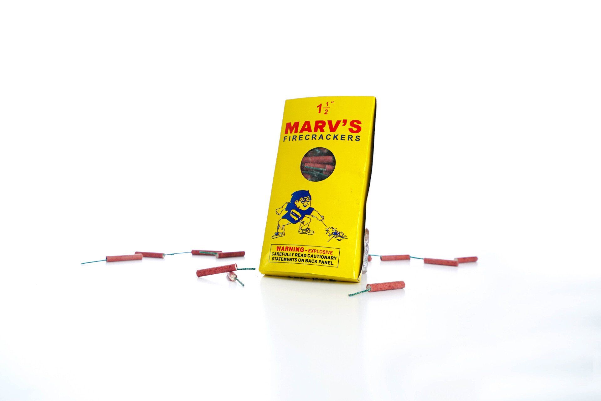 A yellow box of marv 's fireworks is sitting on a white surface.