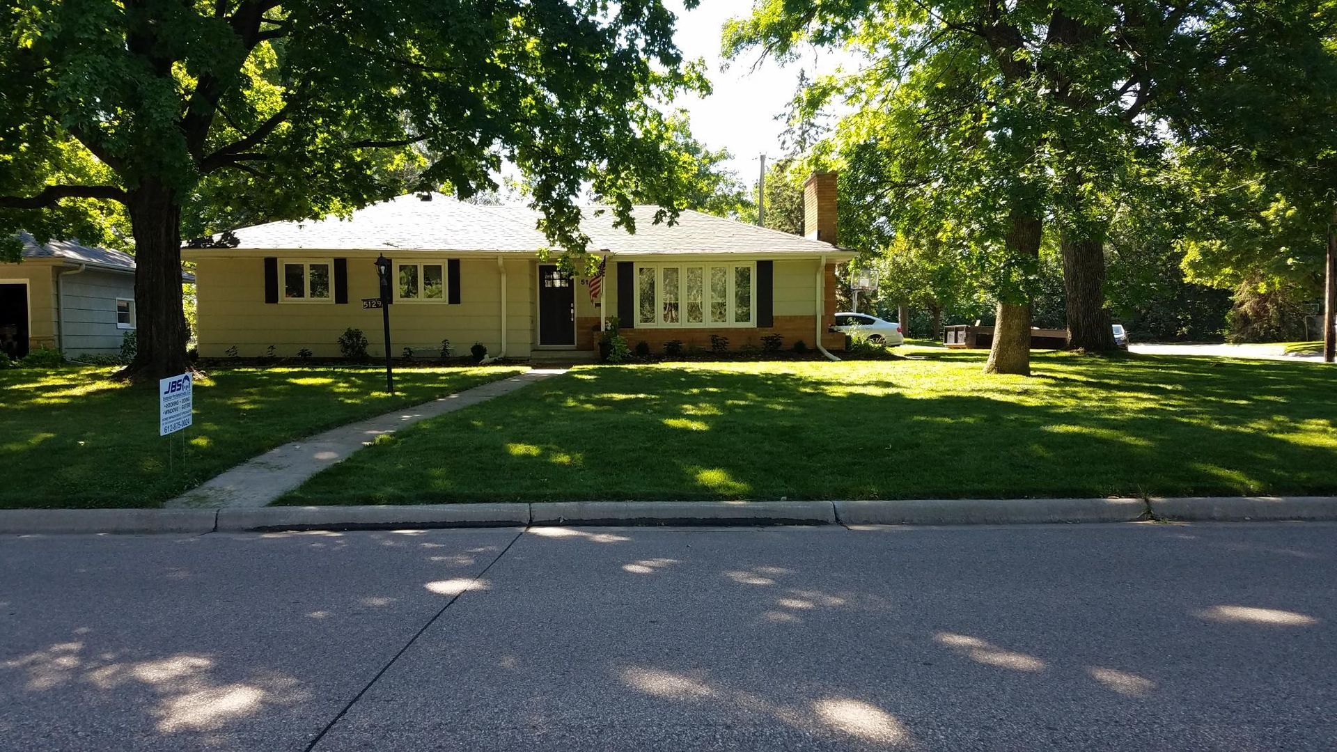 A house with a no parking sign in front of it