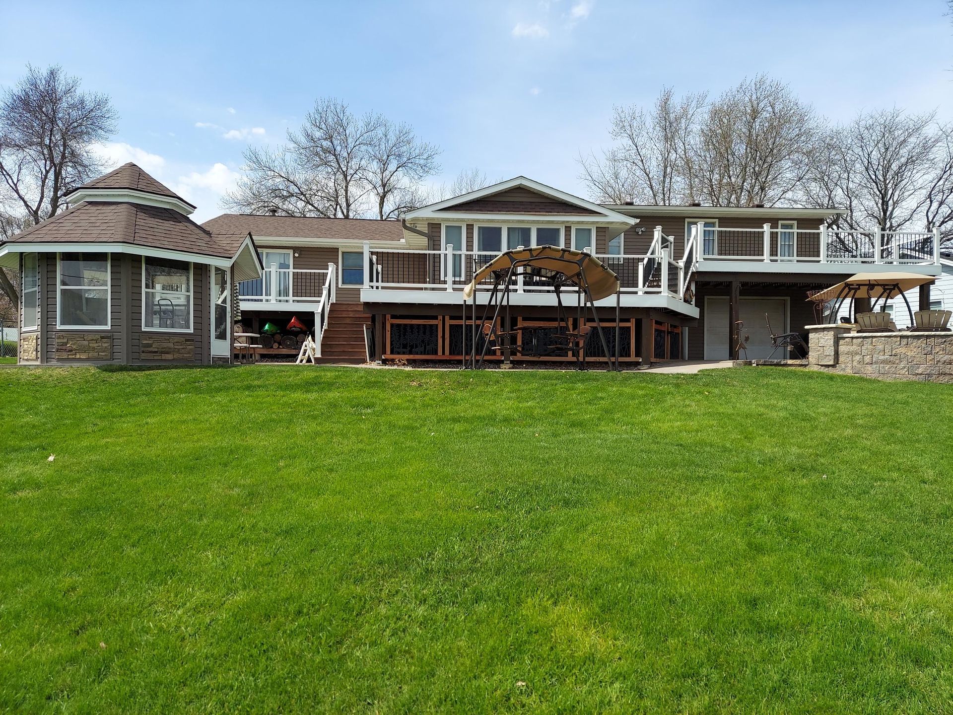 A large house with a large lawn in front of it