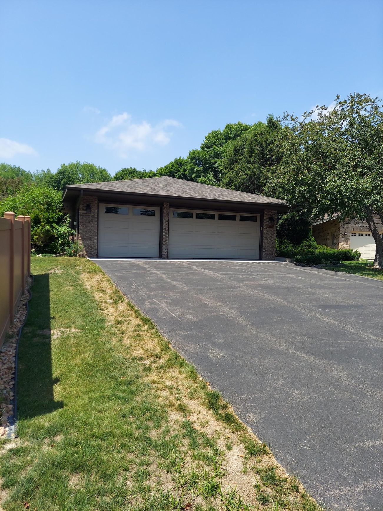 A house with two garage doors and a driveway