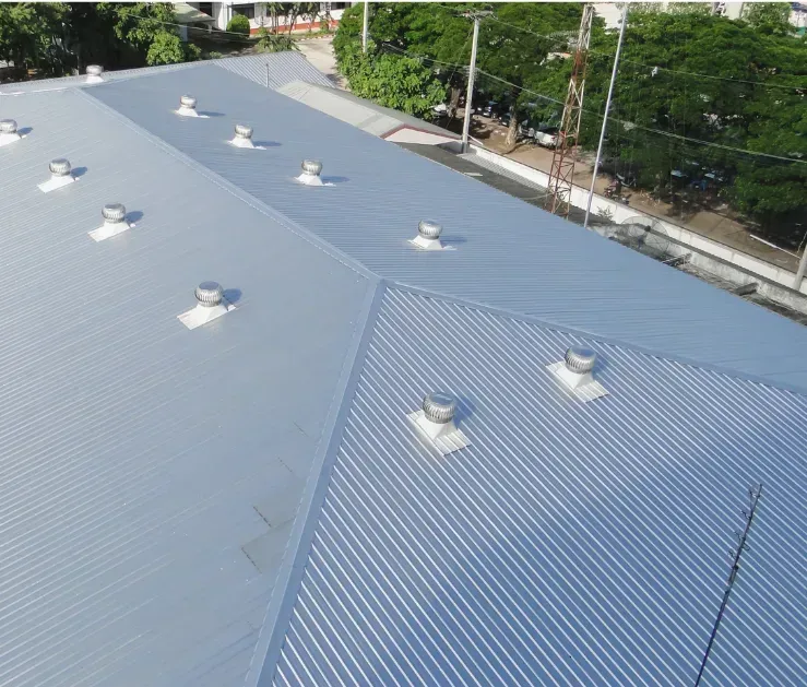 An aerial view of a roof with a lot of vents on it