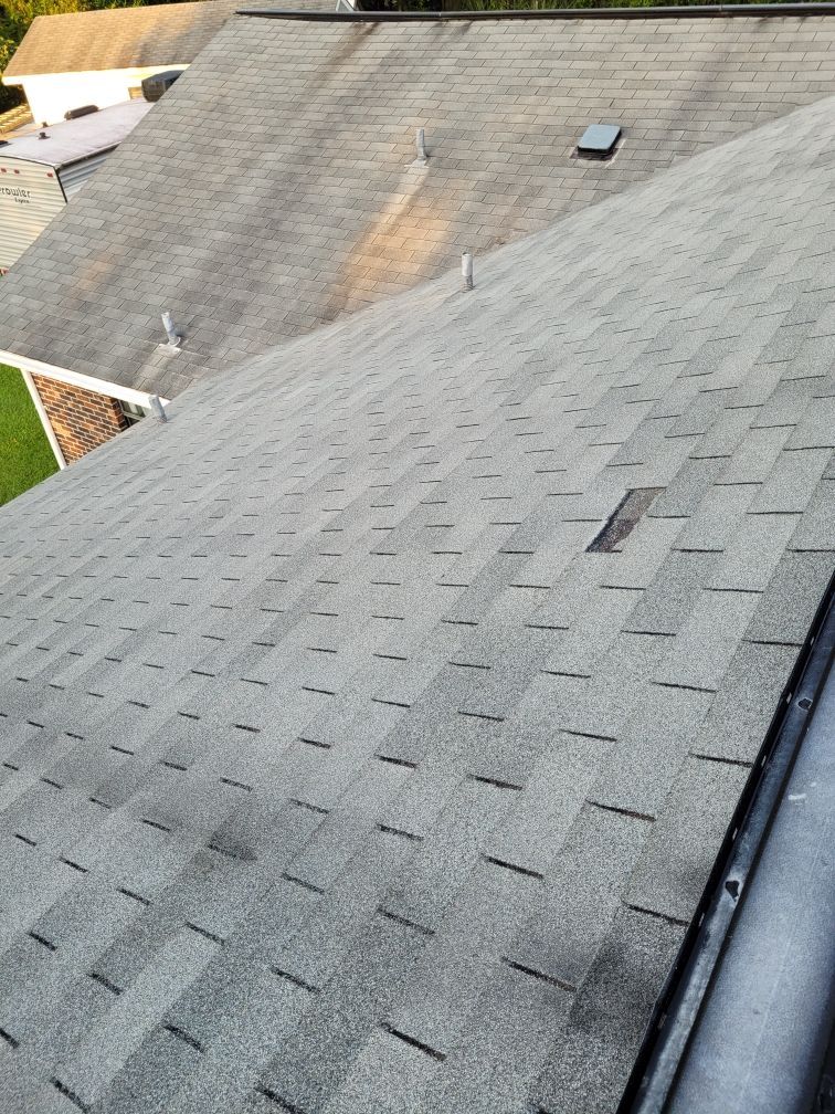 A close up of a roof with shingles on it.