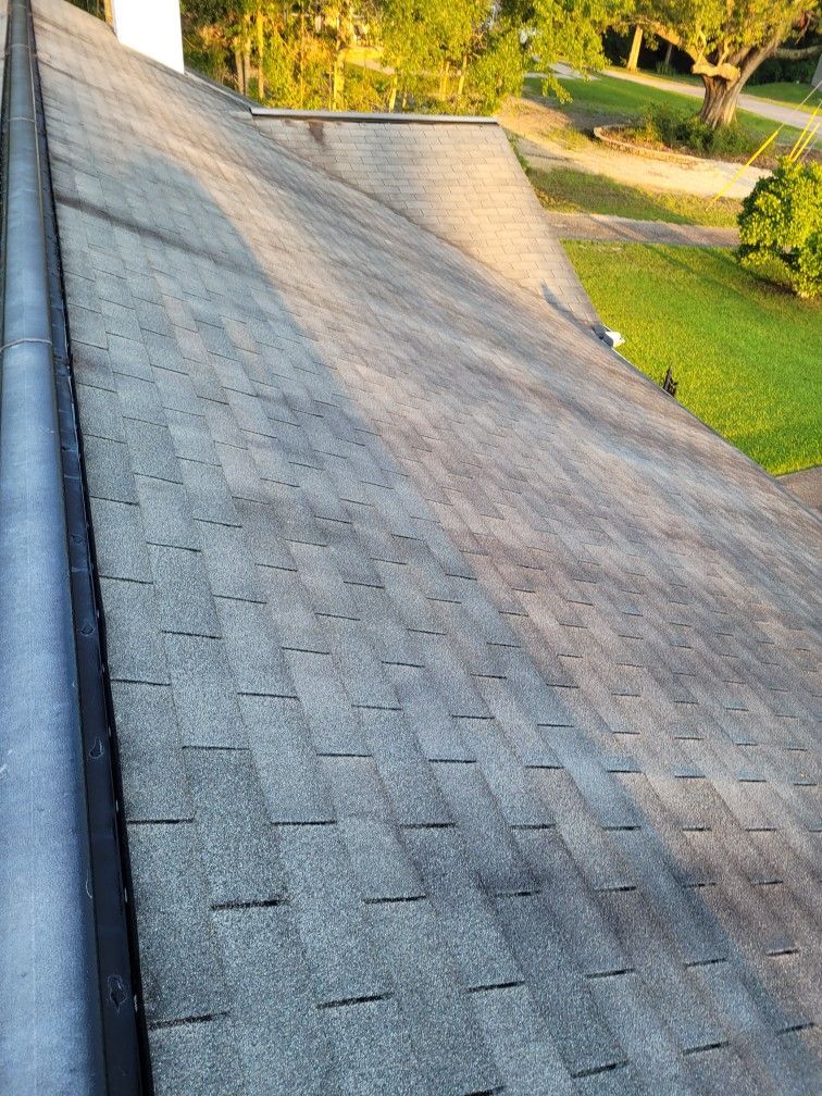 A close up of a roof with a gutter on it.