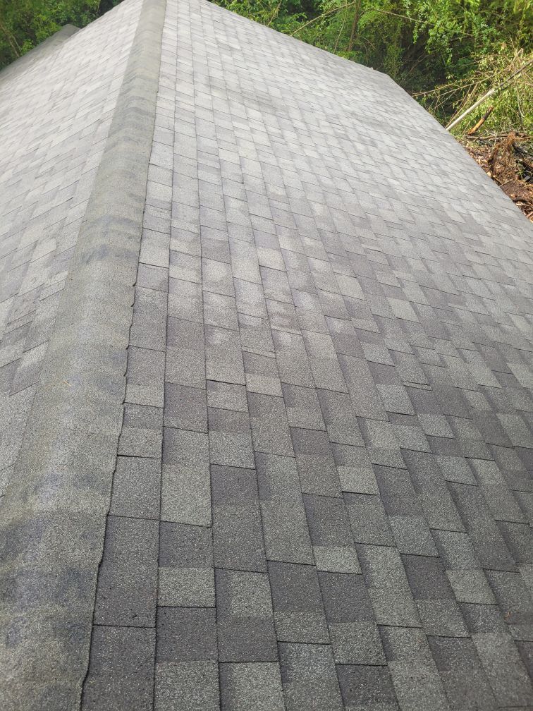 A close up of a roof with shingles on it.