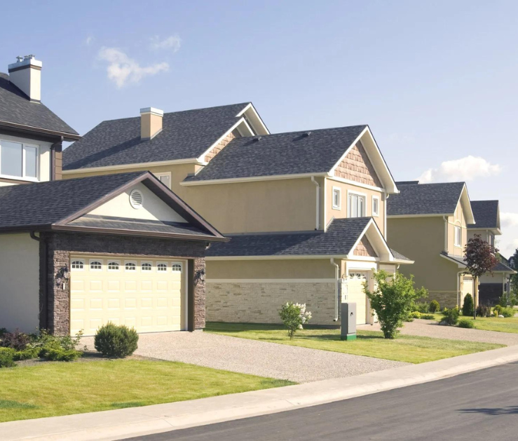 A row of houses with a white garage door