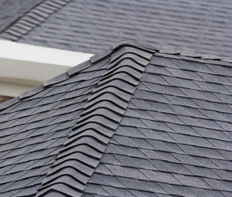 A close up of a roof with shingles on it