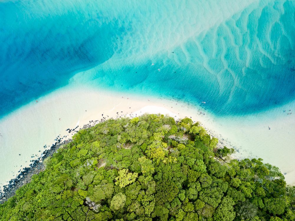 An Aerial View Of A Small Island In The Middle Of The Ocean — Trusted Energy Solutions In Gold Coast, QLD