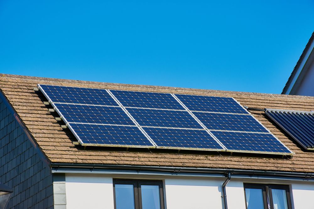 There Are Many Solar Panels On The Roof Of A House — Trusted Energy Solutions In Everton Hills, QLD