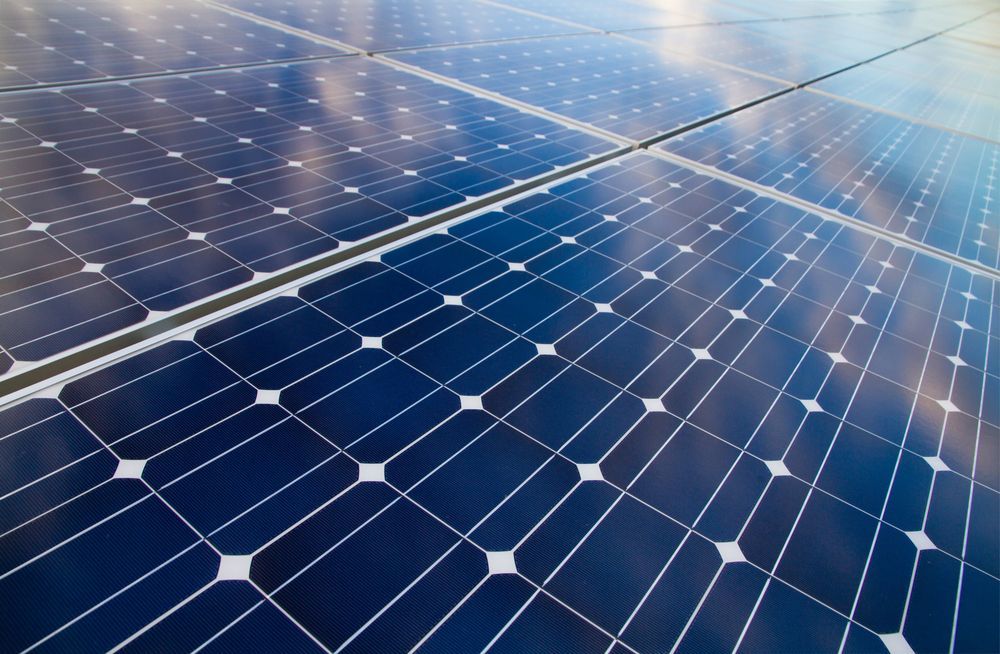A Close Up Of A Row Of Solar Panels On A Roof — Trusted Energy Solutions In Stafford, QLD
