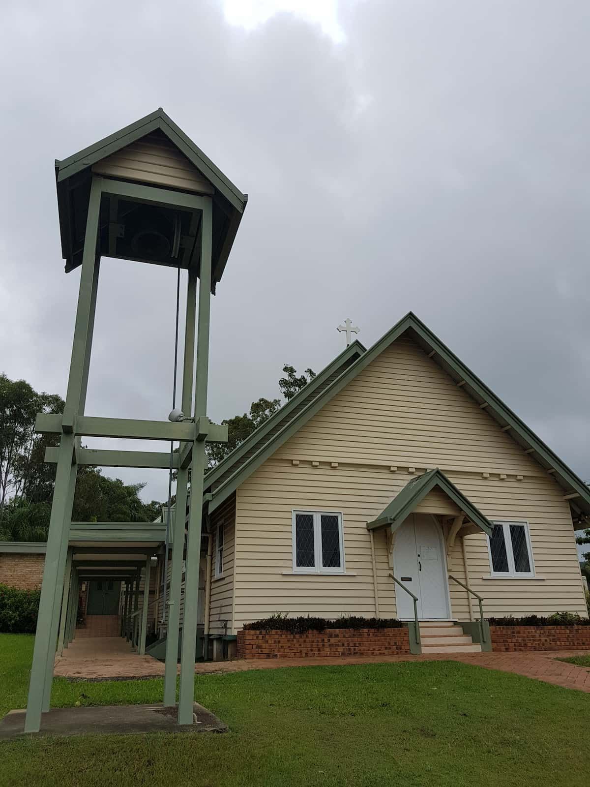 A Church With a Bell Tower in Front of It — Trusted Energy Solutions In Oxenford, QLD