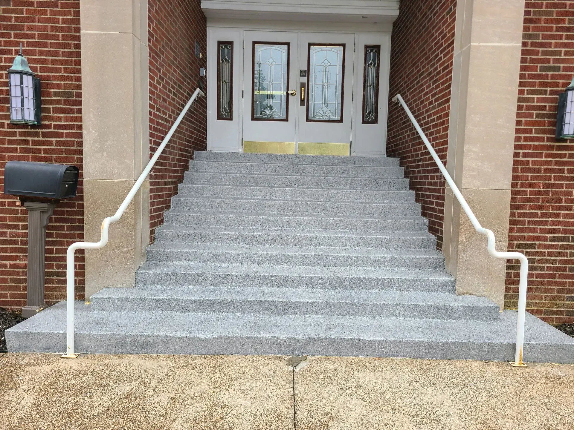 A set of stairs leading up to a brick building