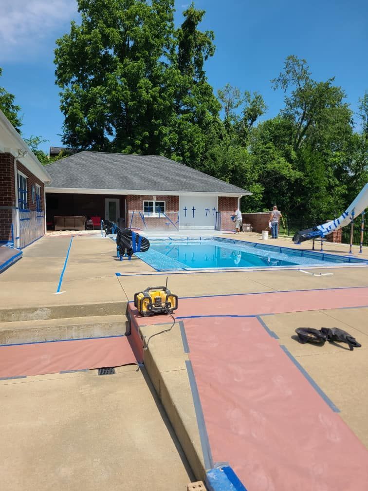 A house with a swimming pool in front of it