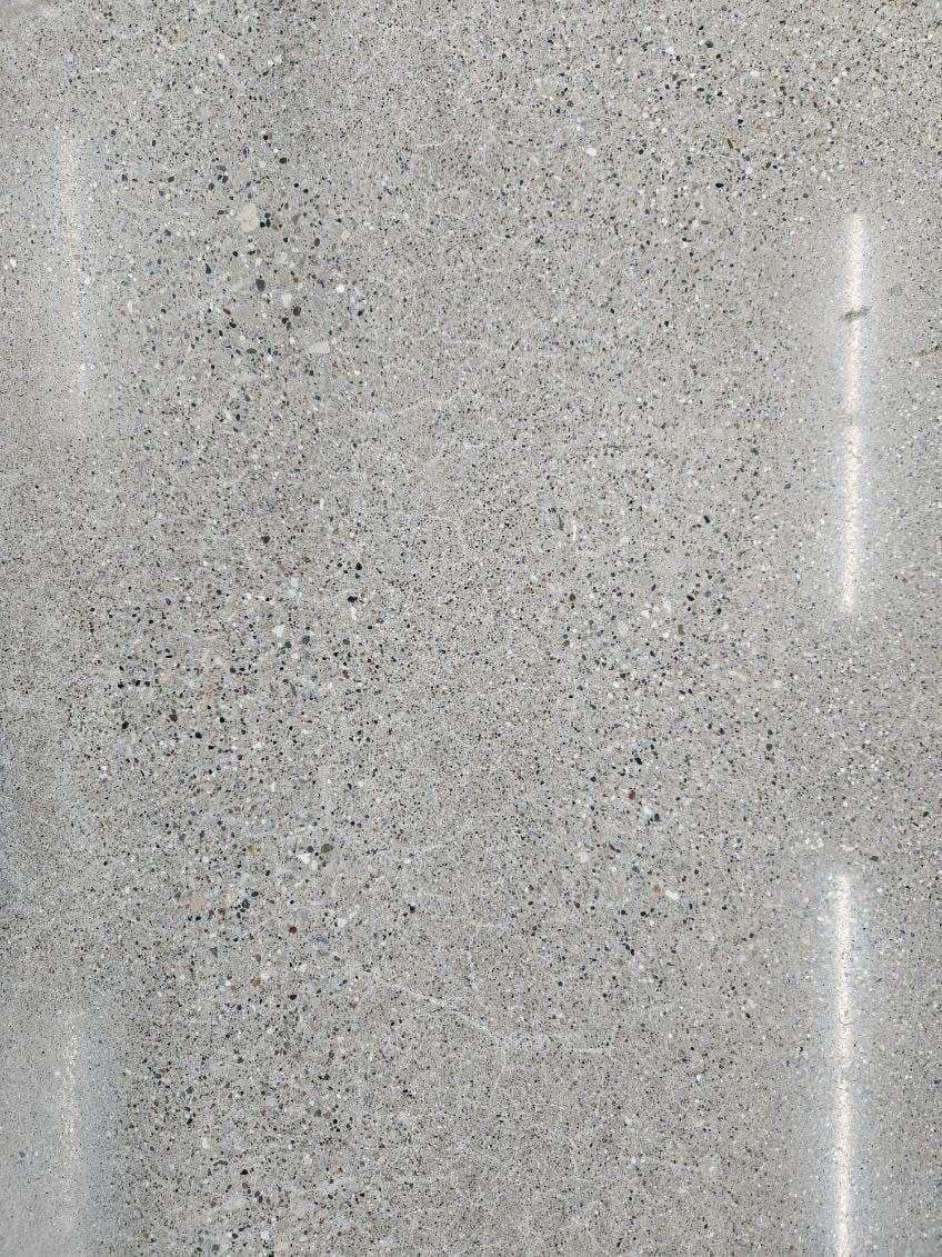 A close up of a gray granite counter top.