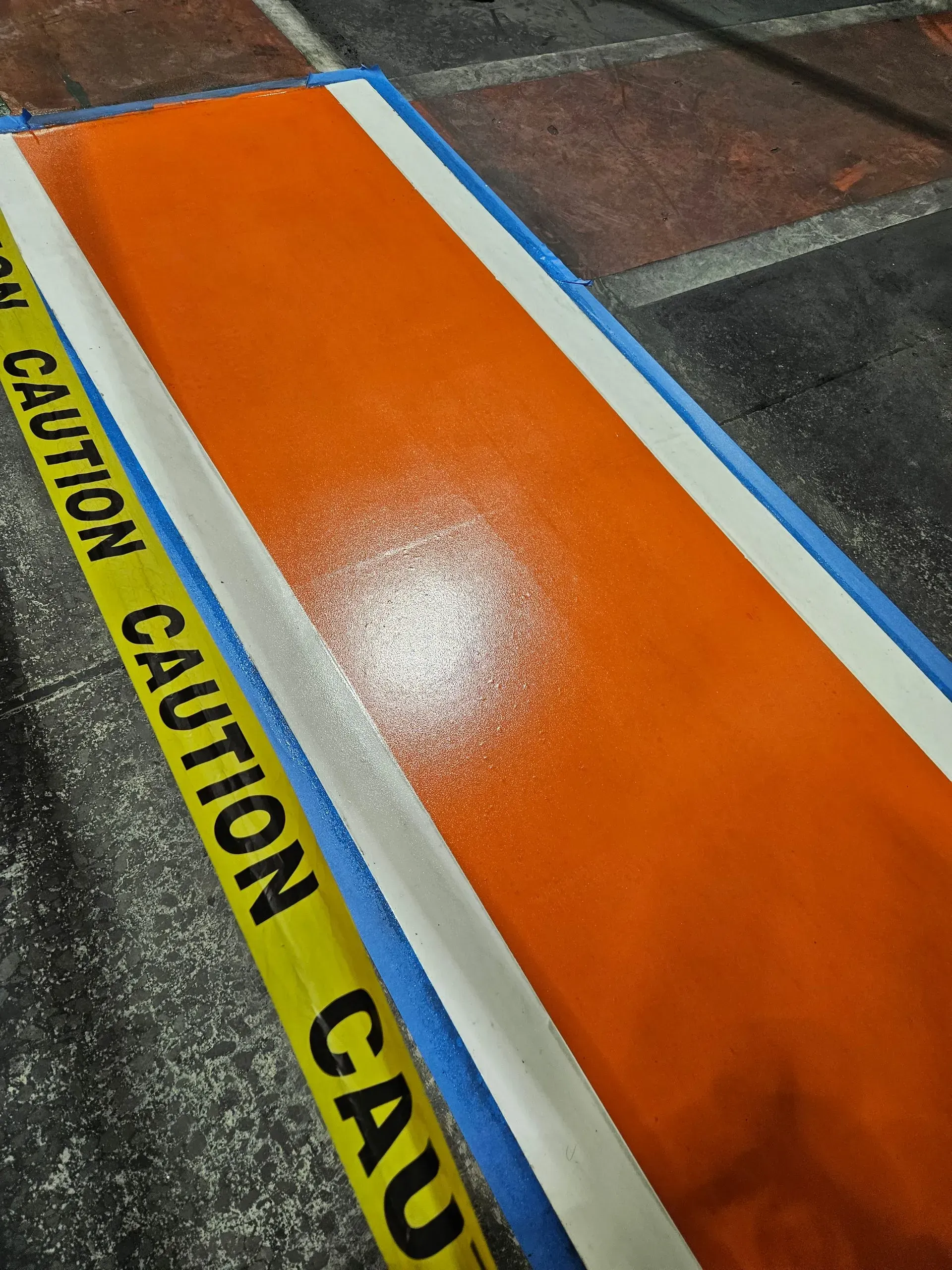 A yellow caution tape is laying on the ground