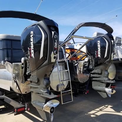 Two evinrude boats are parked next to each other