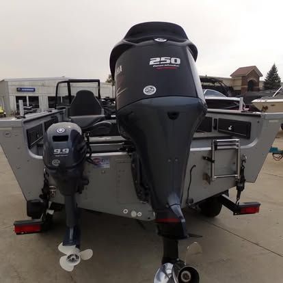 A yamaha 250 outboard motor is attached to the back of a boat.