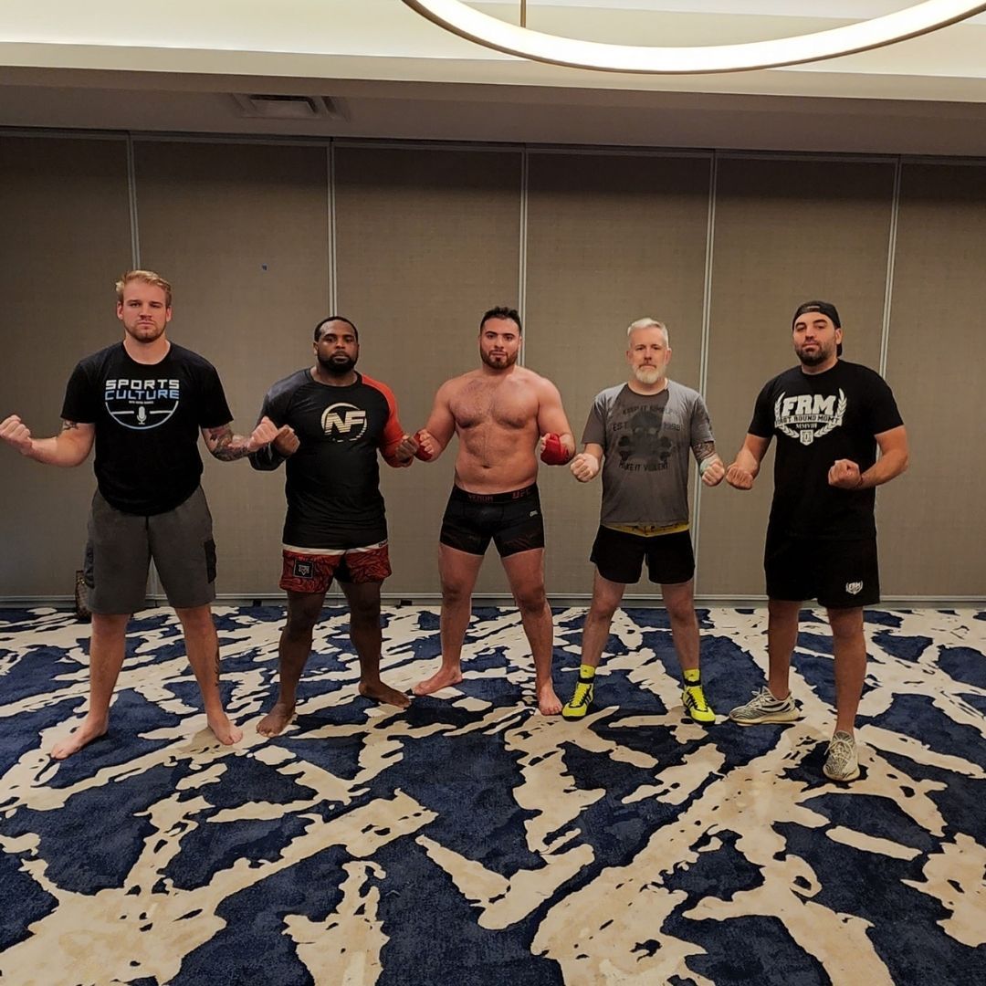 Adults drilling partner combinations at Killer B Combat Academy in Oakhurst, NJ, building fitness.