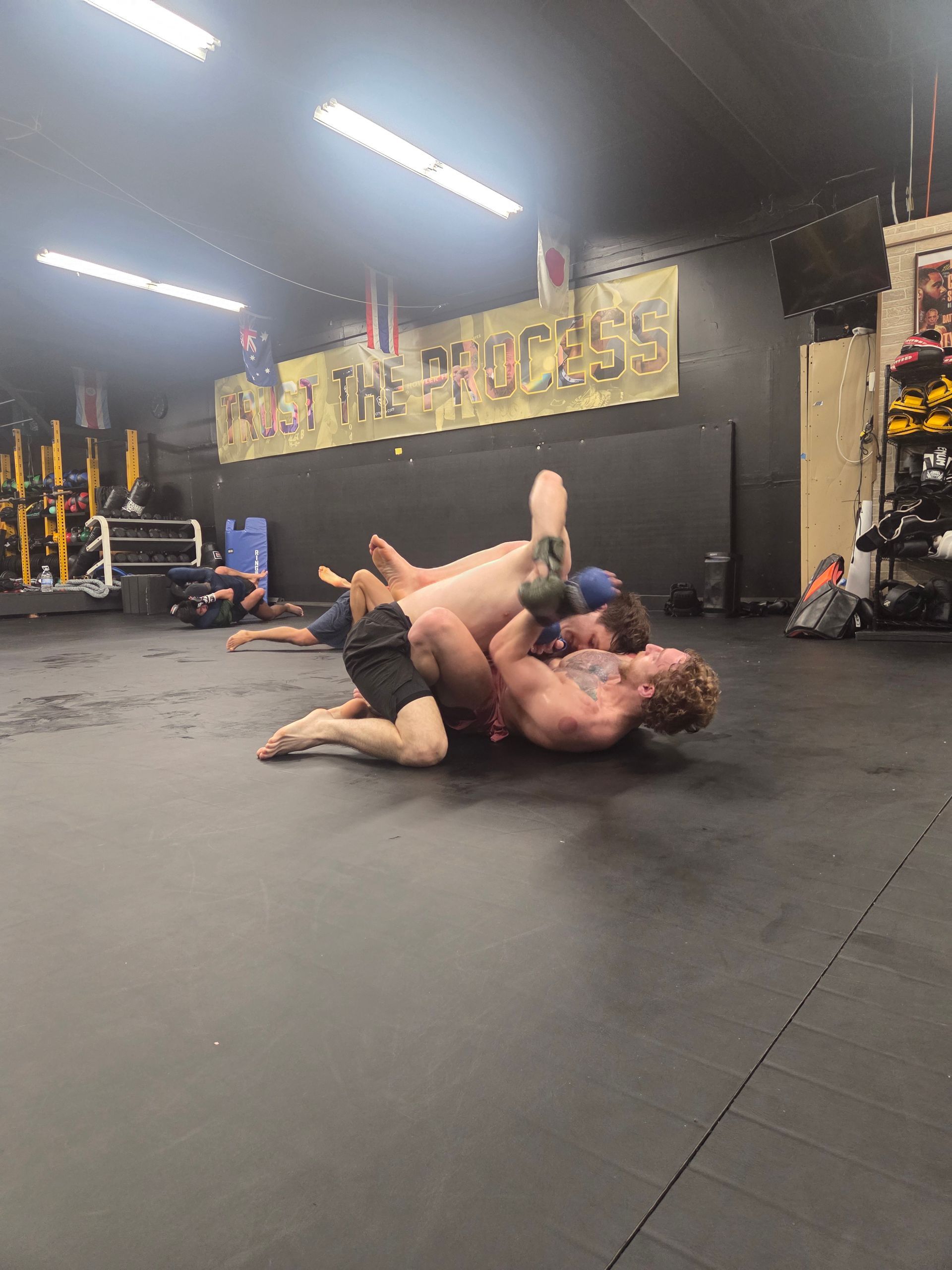 Adults drilling striking and grappling at Killer B Combat Academy in Oakhurst, NJ for fitness.