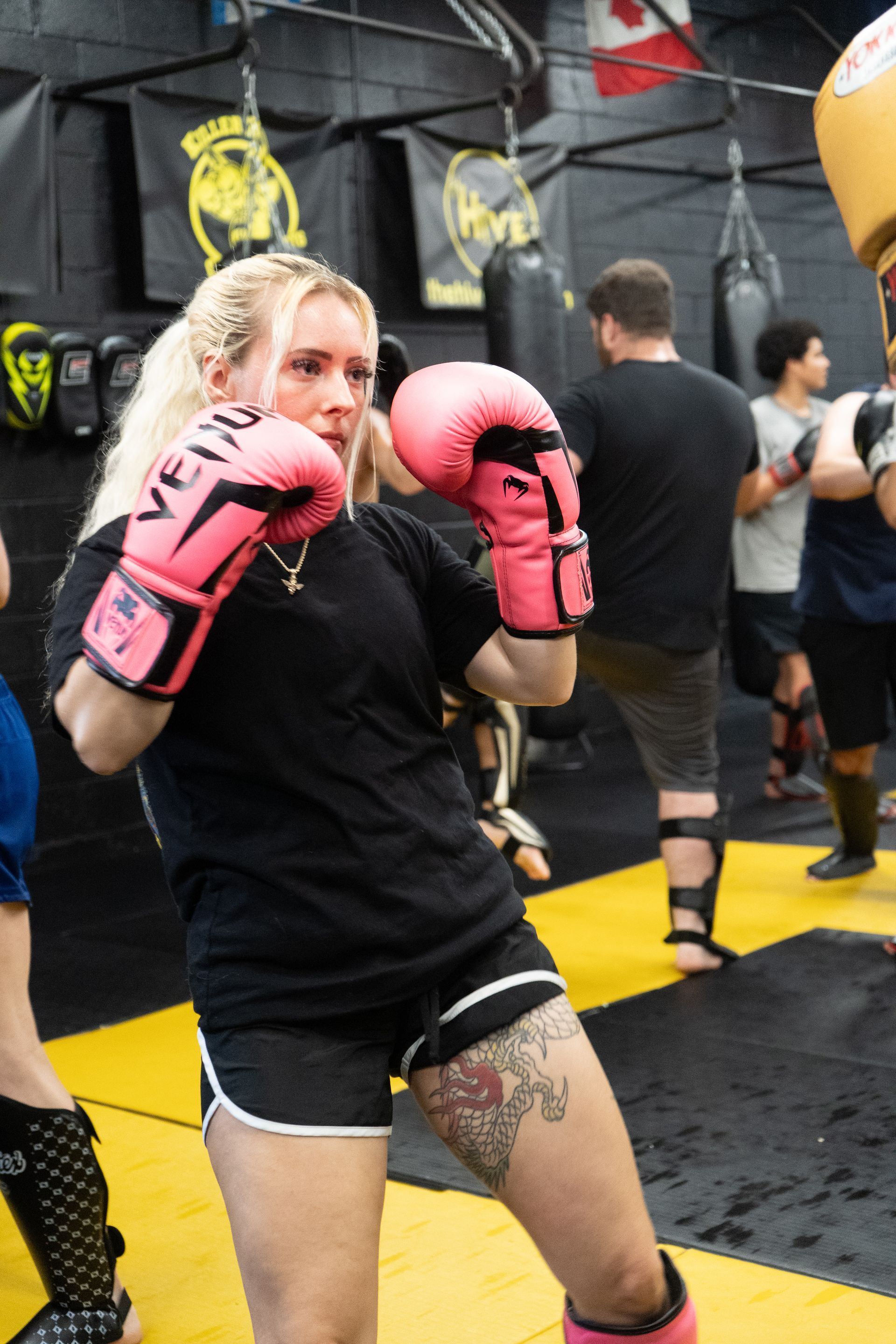 Adults training striking and grappling at Killer B Combat Academy in Oakhurst, NJ.