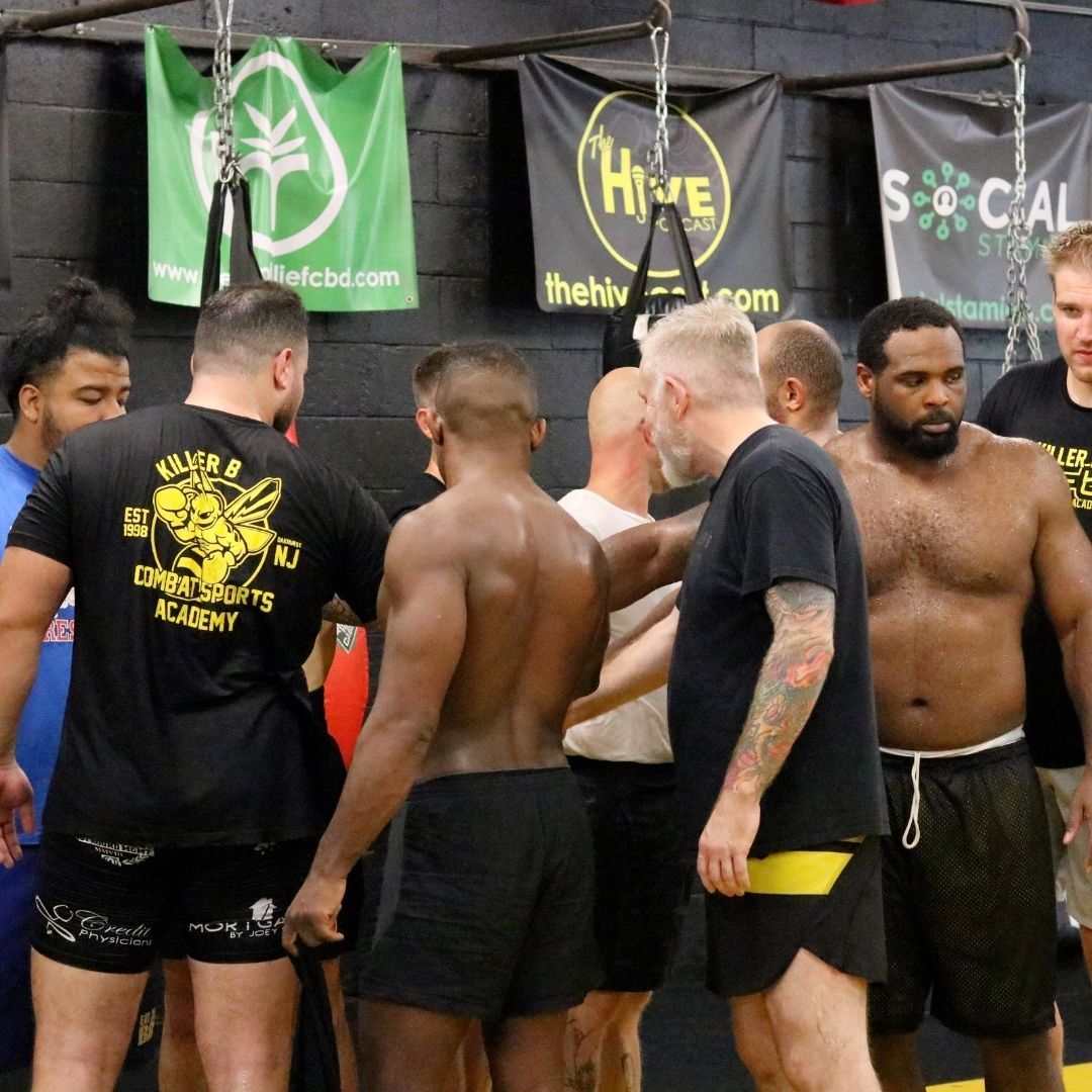 Students training together at Killer B Combat Academy in Oakhurst, NJ, building fitness, and trust,