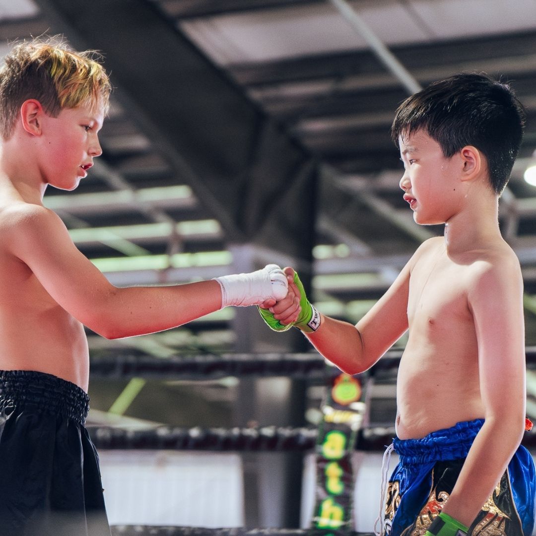 Adults practicing kickboxing and grappling drills at Killer B Combat Academy in Oakhurst, NJ.