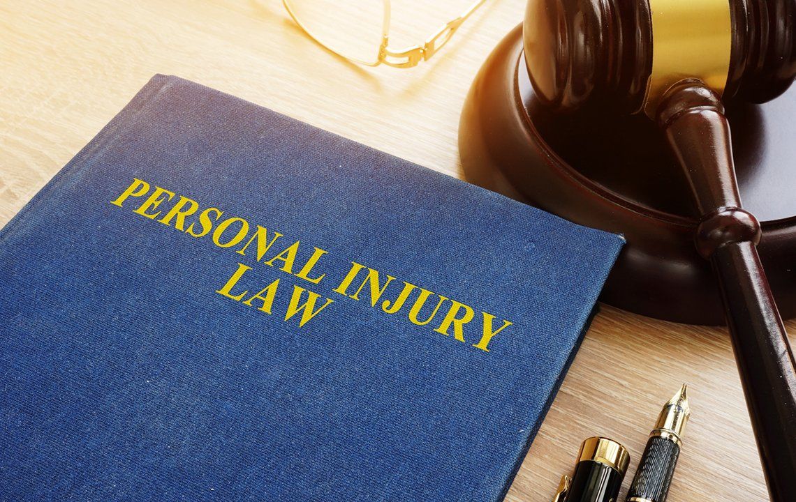 Personal Injury Law Book and Gavel — Montgomery, AL — Donohoe & Stapleton, LLC