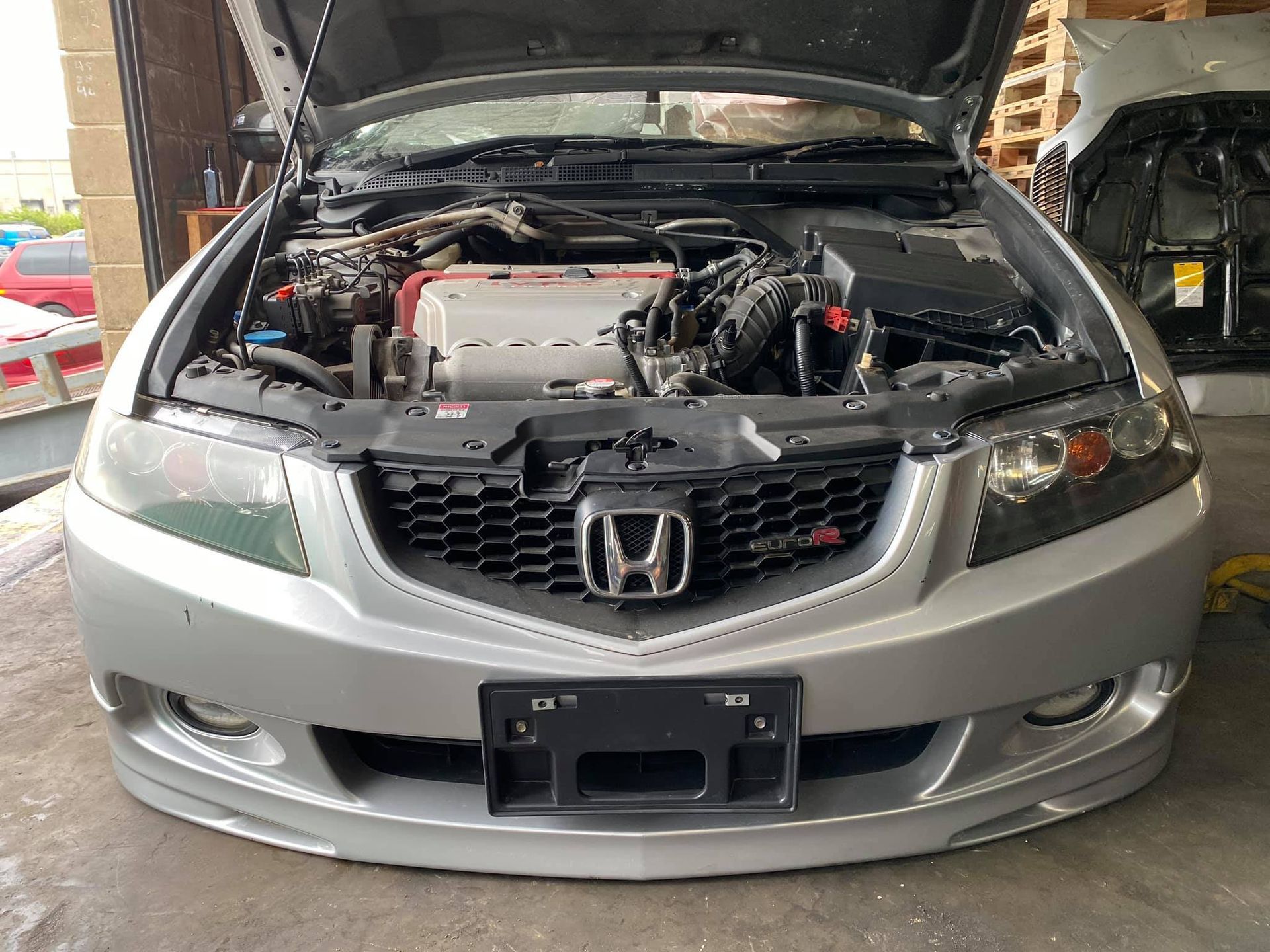 A pile of metal pieces with holes in them