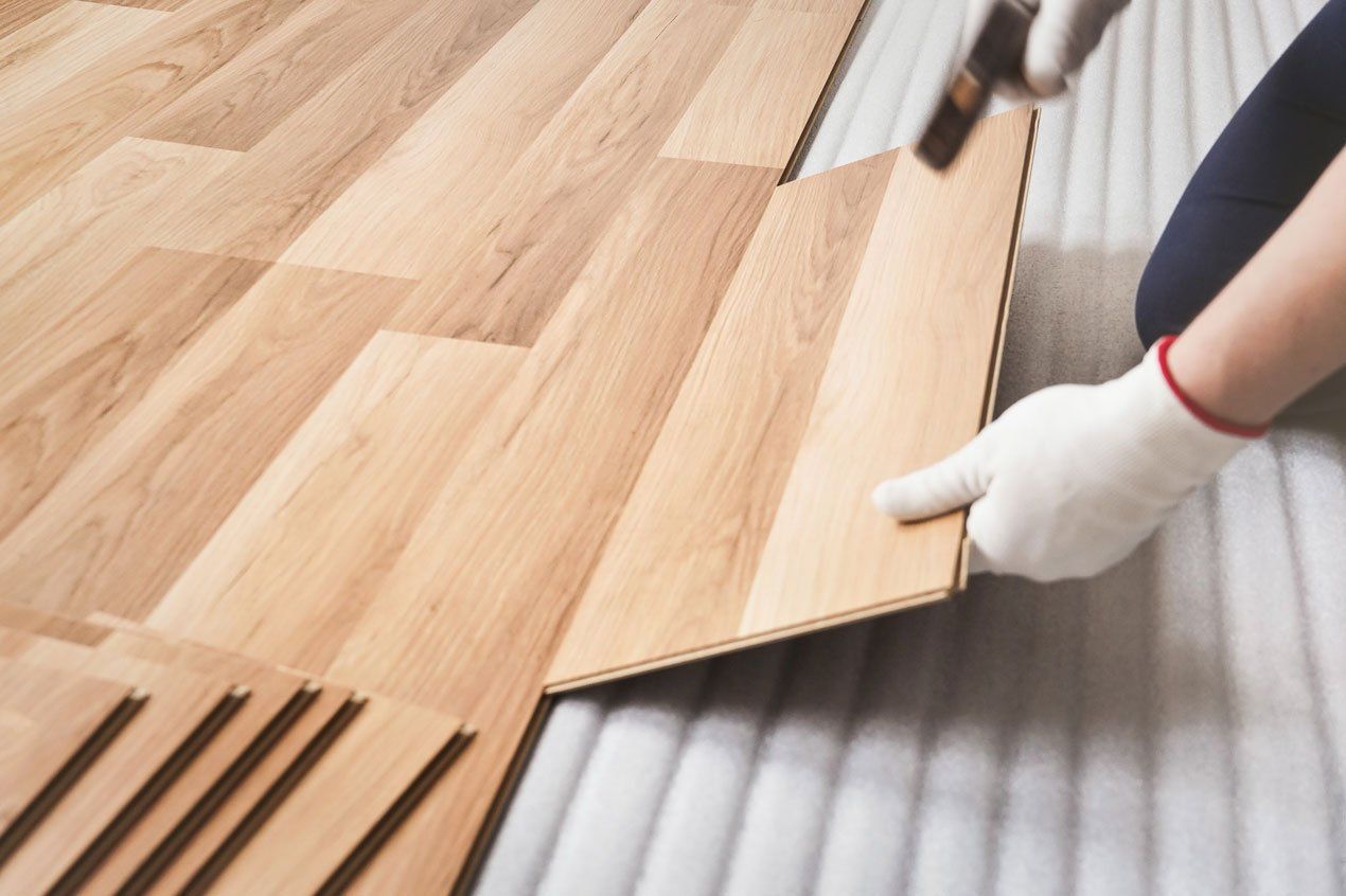 Installing laminated floor — Louisville, KY — Chuck Cole Flooring LLC