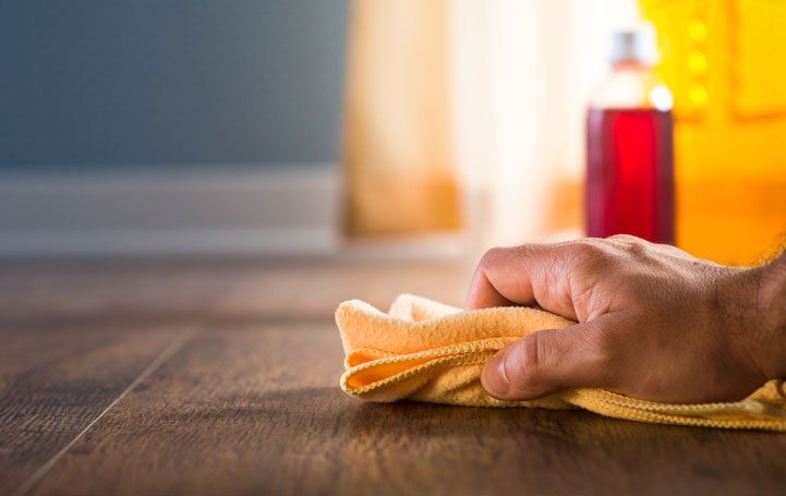 Applying wood care products — Louisville, KY — Chuck Cole Flooring LLC