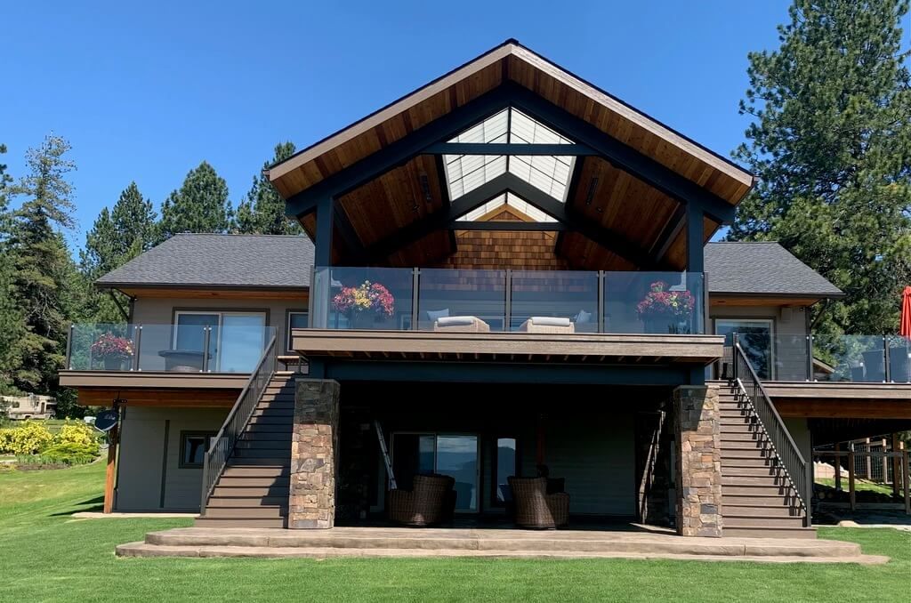 A large house with a large deck and stairs
