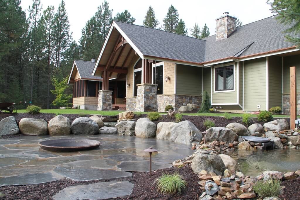 A large house with a pond in front of it