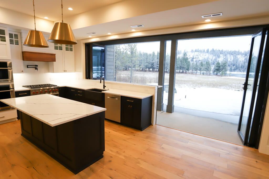 There is a large island in the middle of the kitchen.