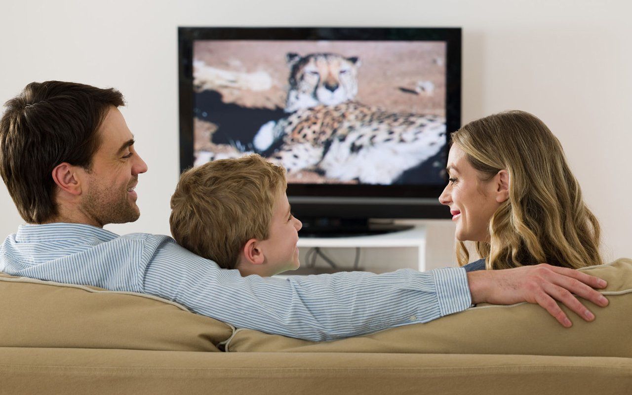 a family watching TV