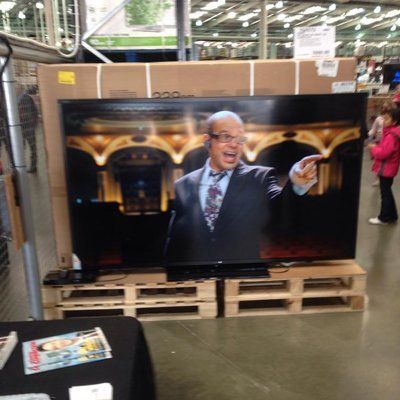 TV mounted on wooden plank