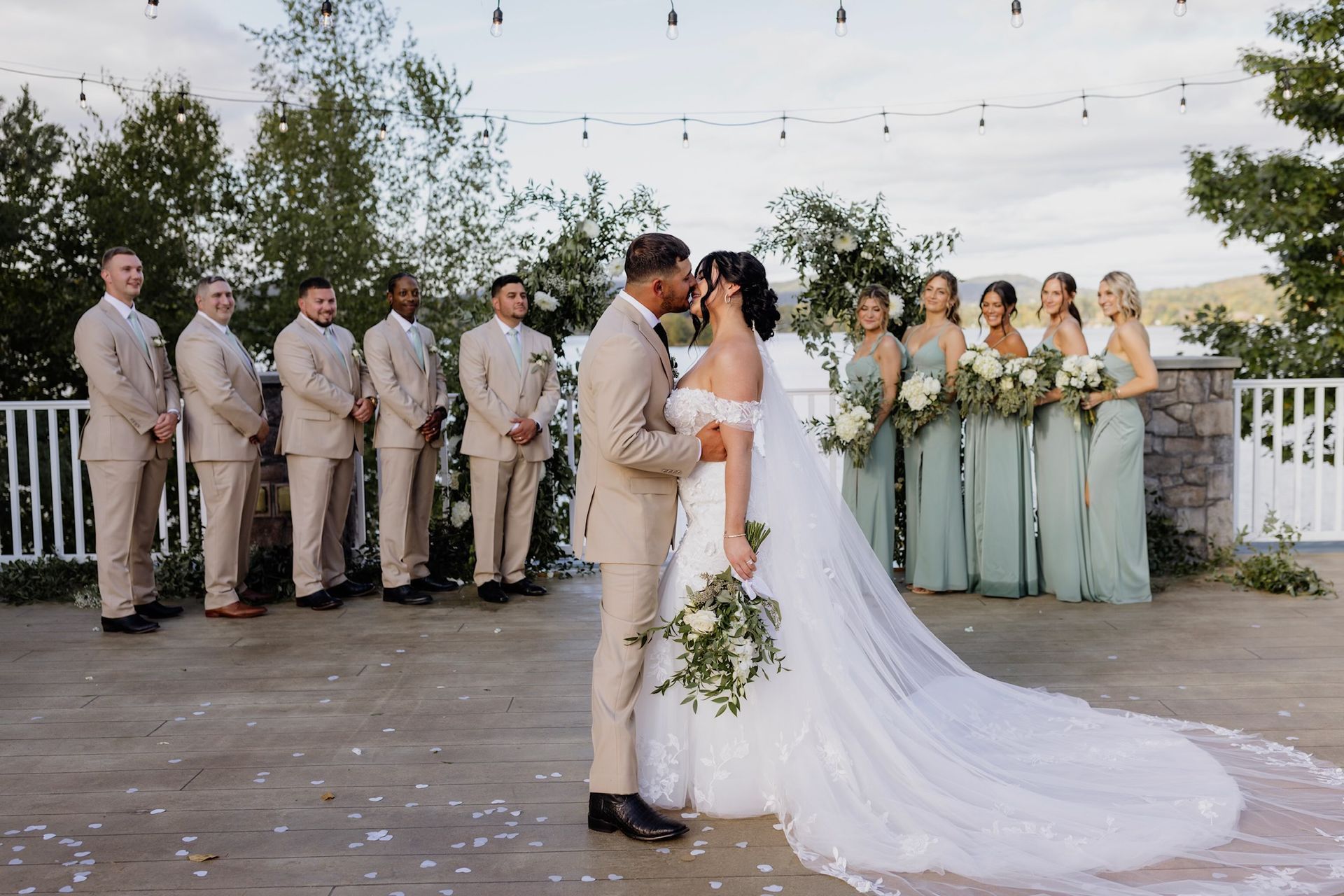 A Table Set For A Wedding Reception With Plates , Utensils , And Flowers — Pittsfield, MA — Black Luxe Luxury Car