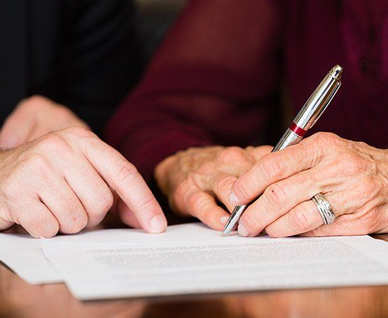 Signing A Document — Lake City, FL — Lloyd E. Peterson Jr., Sandra H. Peterson, Attorneys At Law