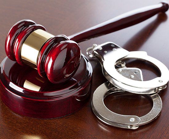 Gavel And Handcuffs — Lake City, FL — Lloyd E. Peterson Jr., Sandra H. Peterson, Attorneys At Law